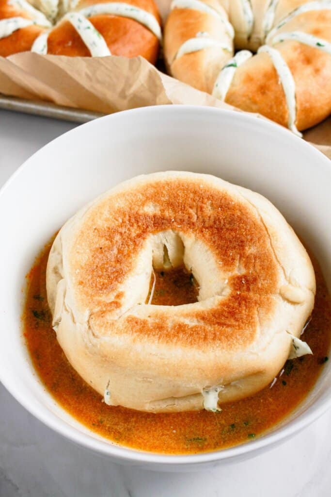Bread being dipped in butter.