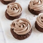 Frosted cookies on parchment paper.