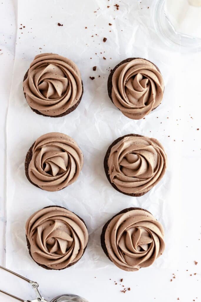 Chocolate cookies on parchment paper.