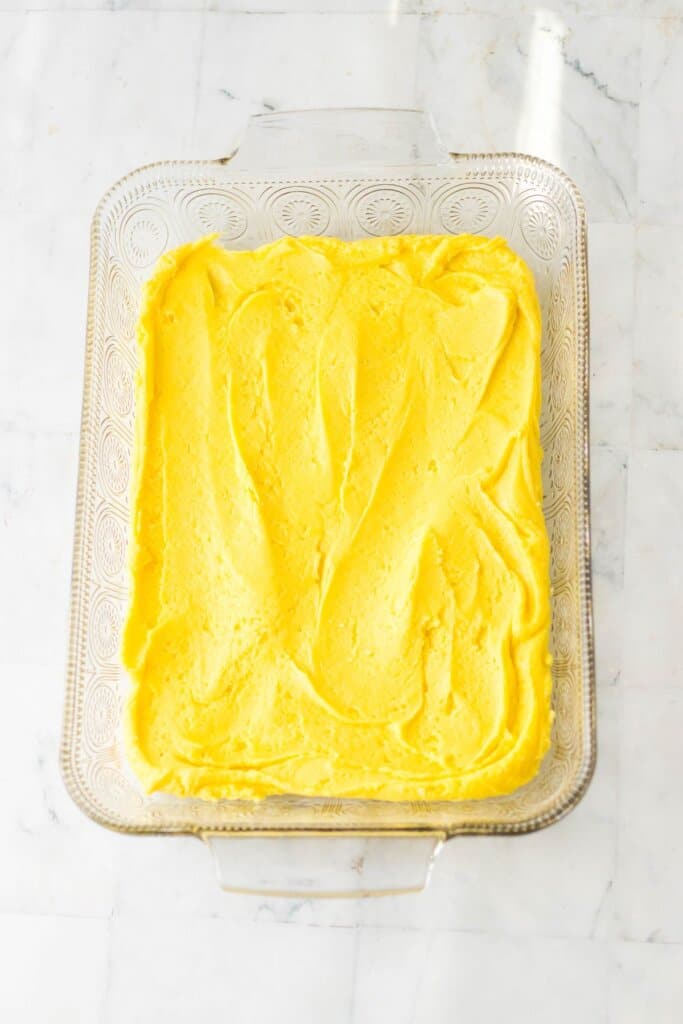 Cake batter in a glass baking dish.