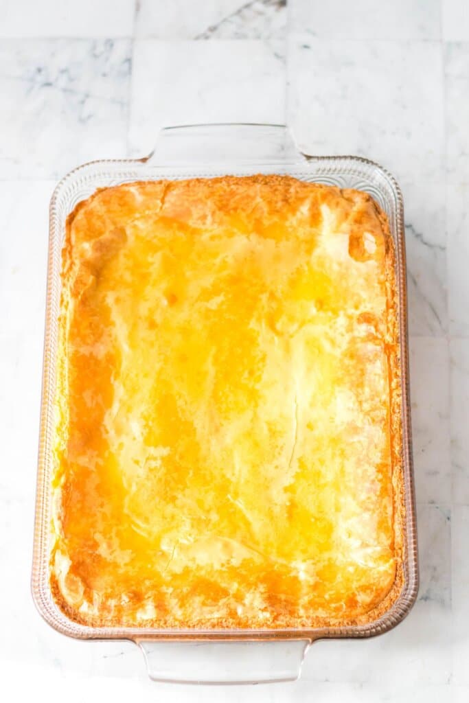 Gooey butter cake in a glass baking dish.