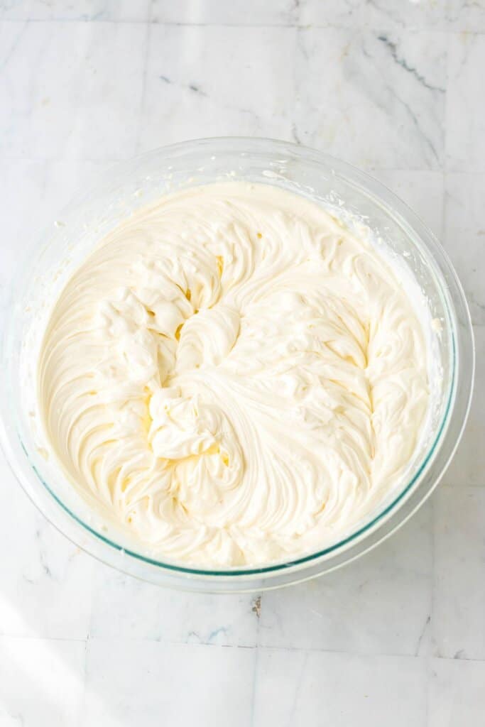 Batter being mixed in a glass bowl.