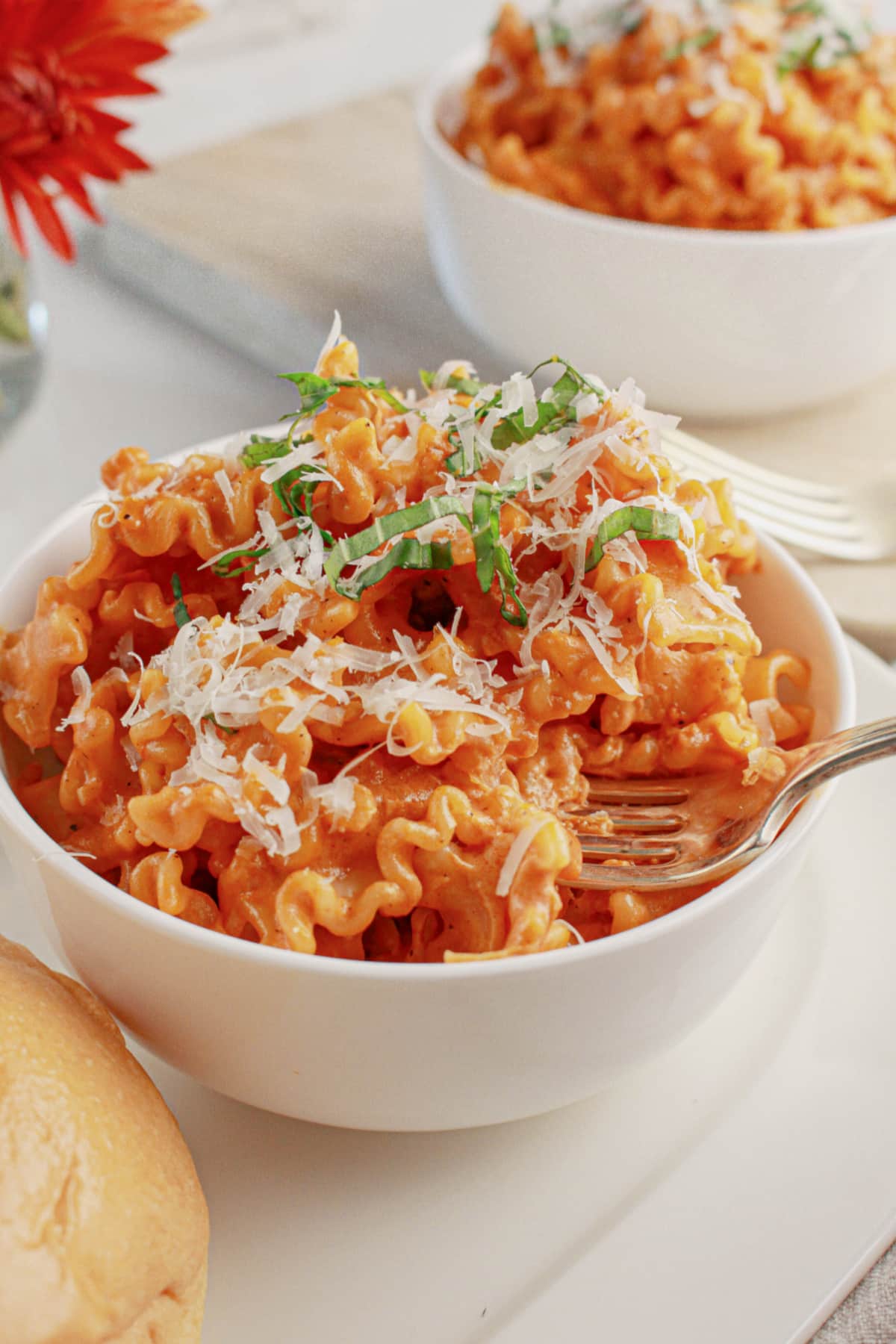 White bowl full of pasta alla vodka.