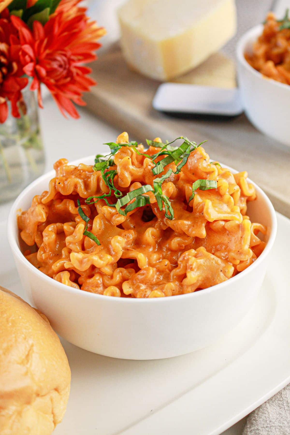 White bowl full of pasta alla vodka.