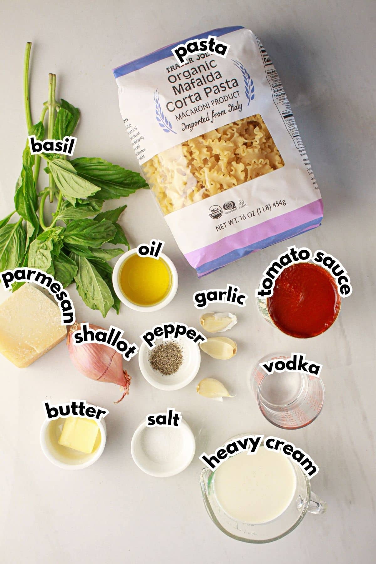 Bowls of ingredients labelled with text on a counter.