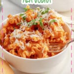 White bowl full of pasta alla vodka.