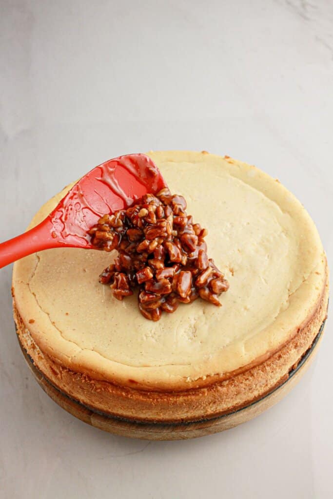 Topping is spread on top of the dessert.