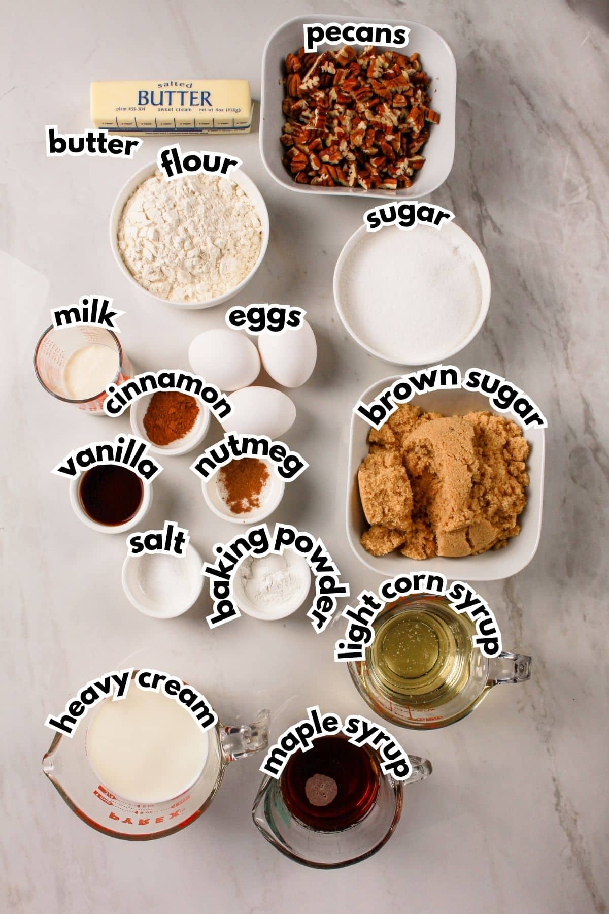 Bowls of ingredients labelled with text on a counter.