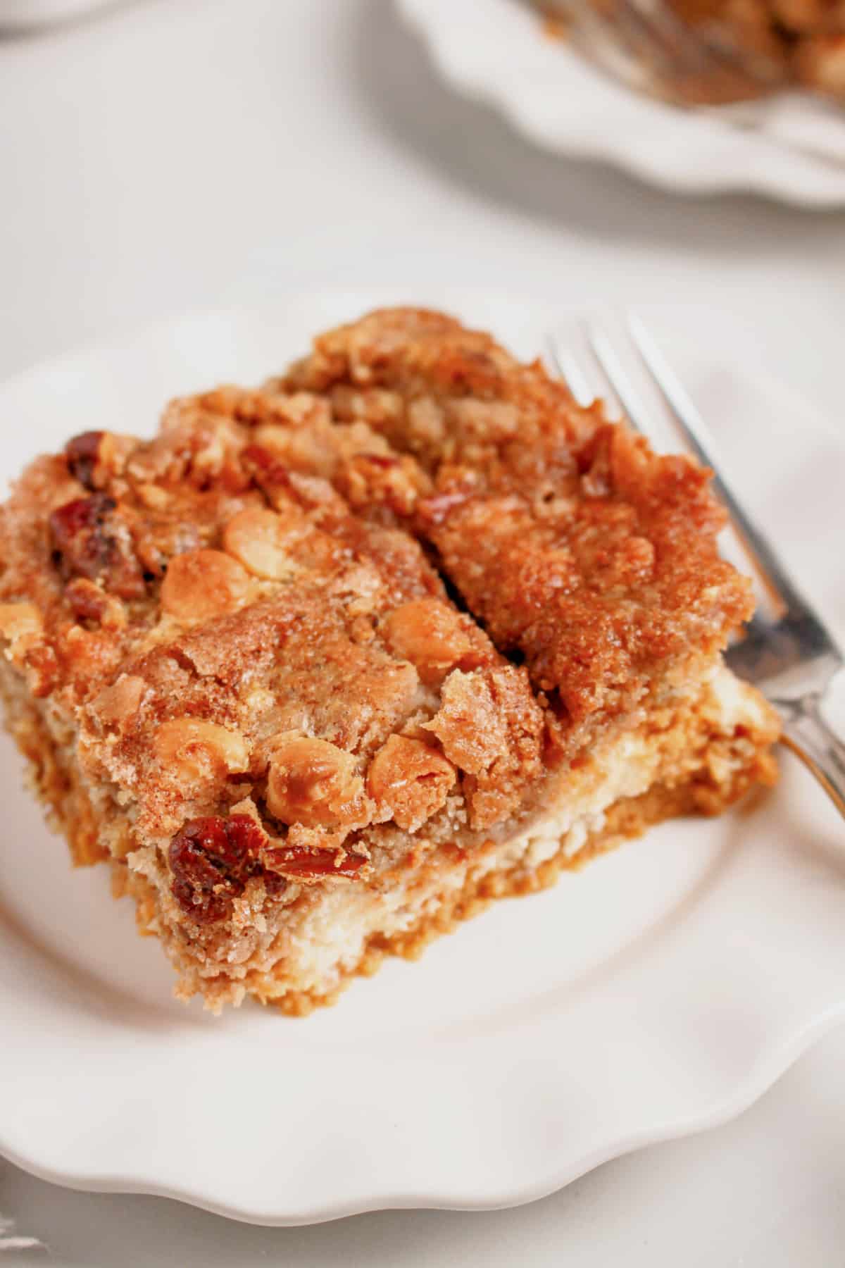 Slice of pumpkin pecan dump cake on a plate. Slice of pumpkin pecan dump cake on a plate.
