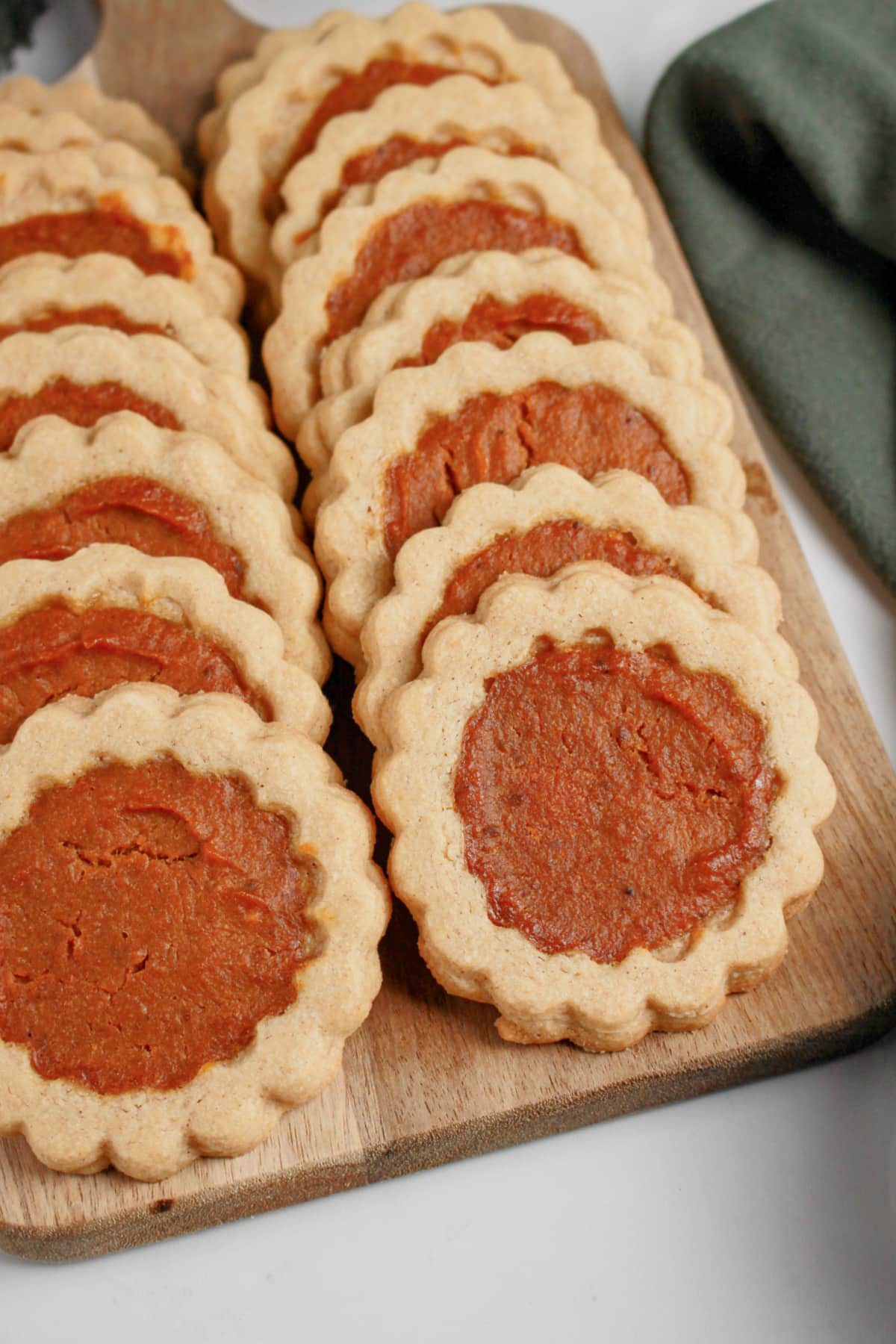 Pumpkin pie cookies on a wooden tray.