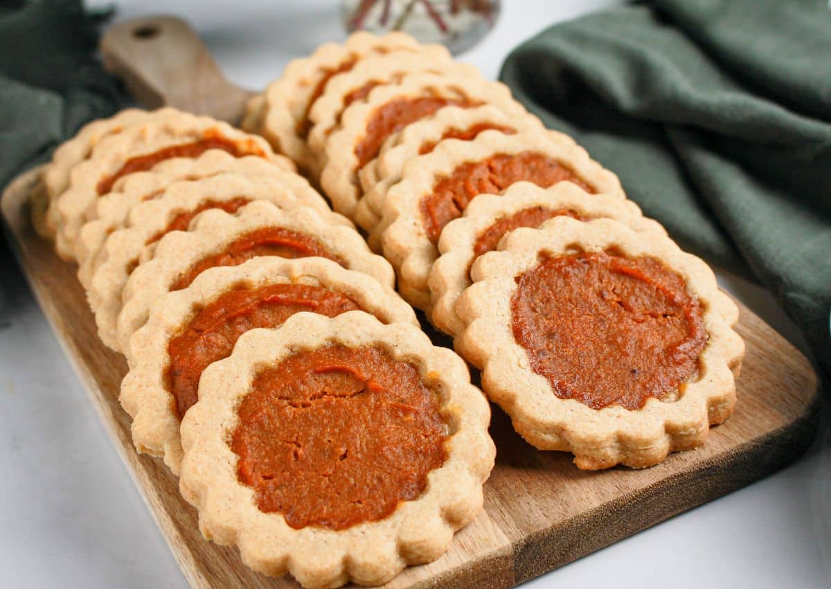 Pumpkin pie cookies on a wooden tray.