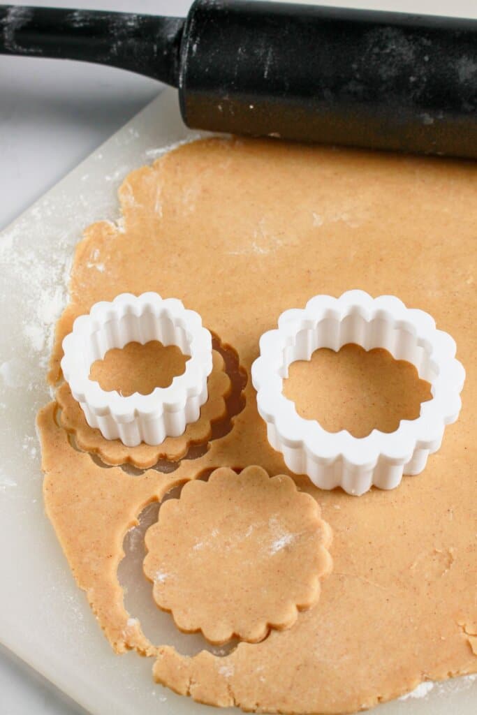 Dough being cut into scalloped shapes.