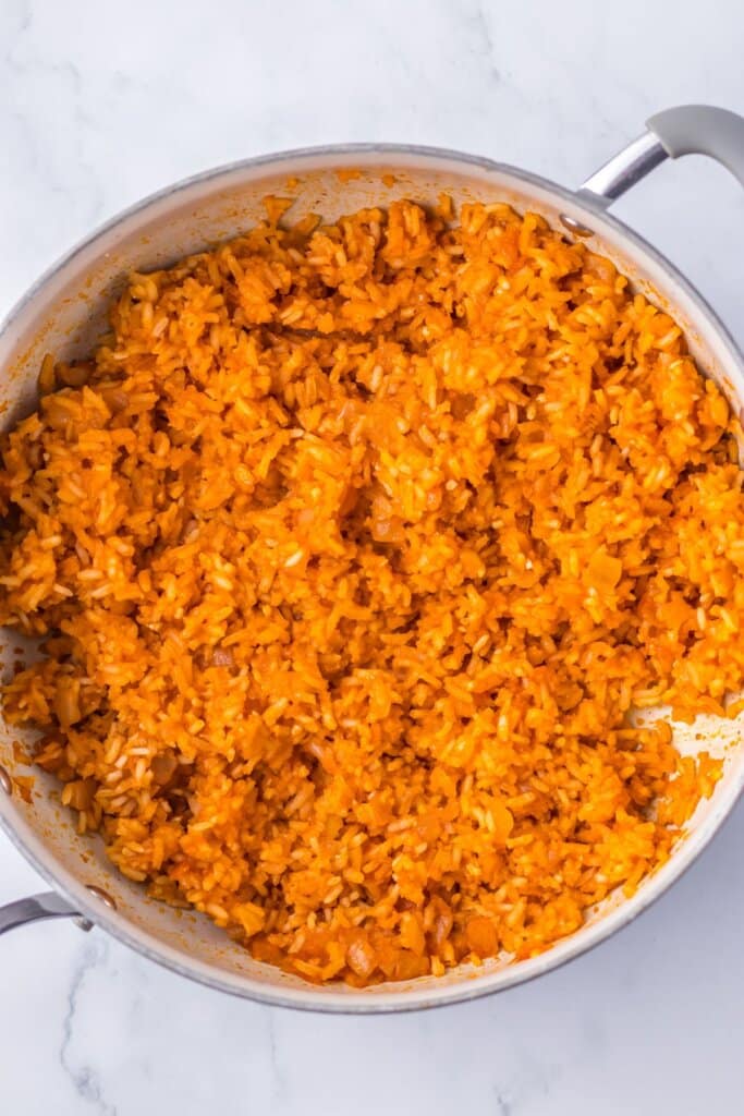 Cooked rice in a skillet.