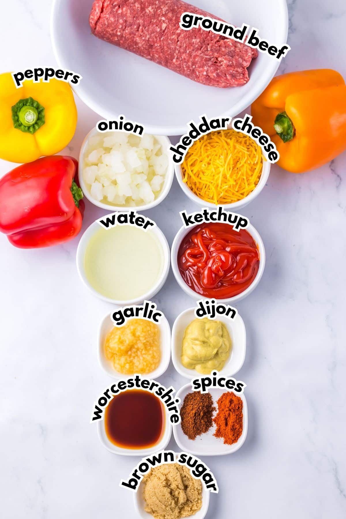 Bowls of ingredients labeled with text on a counter.