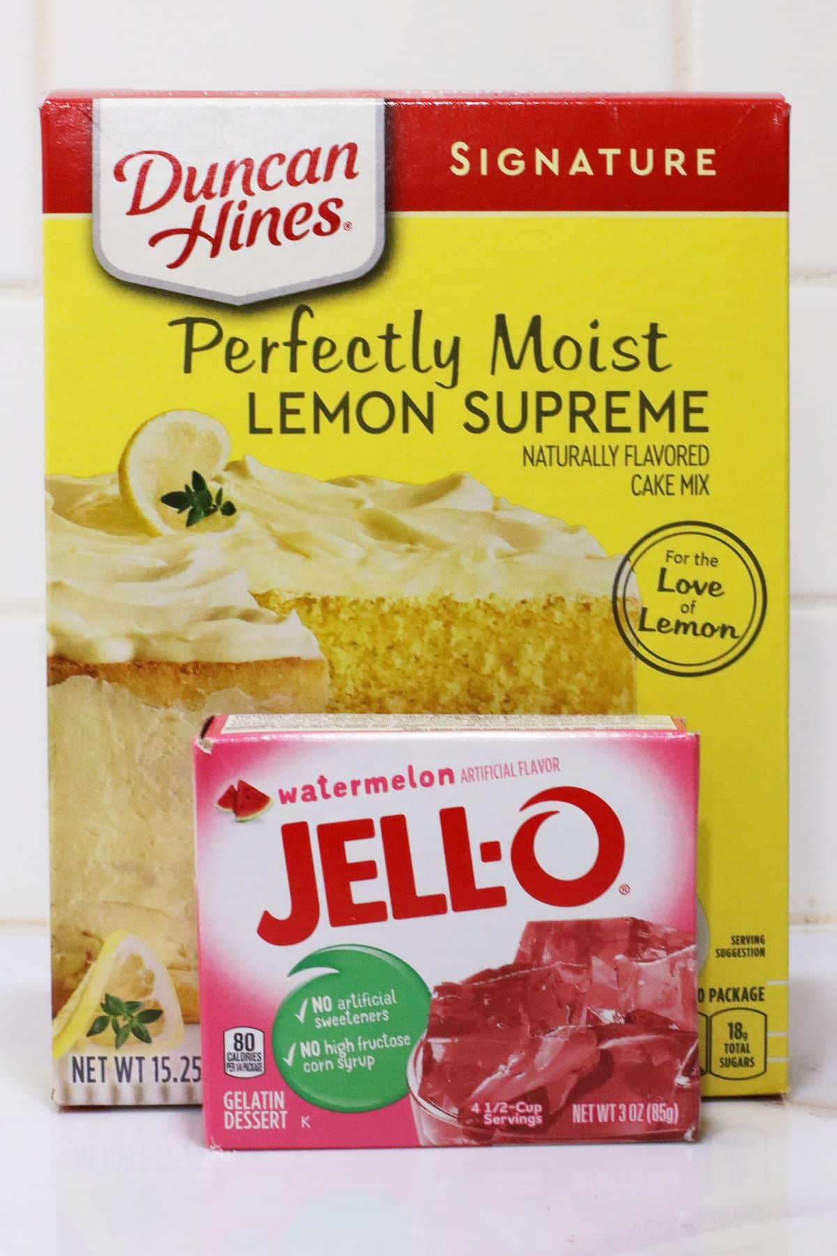 Box of cake mix and jello on counter.