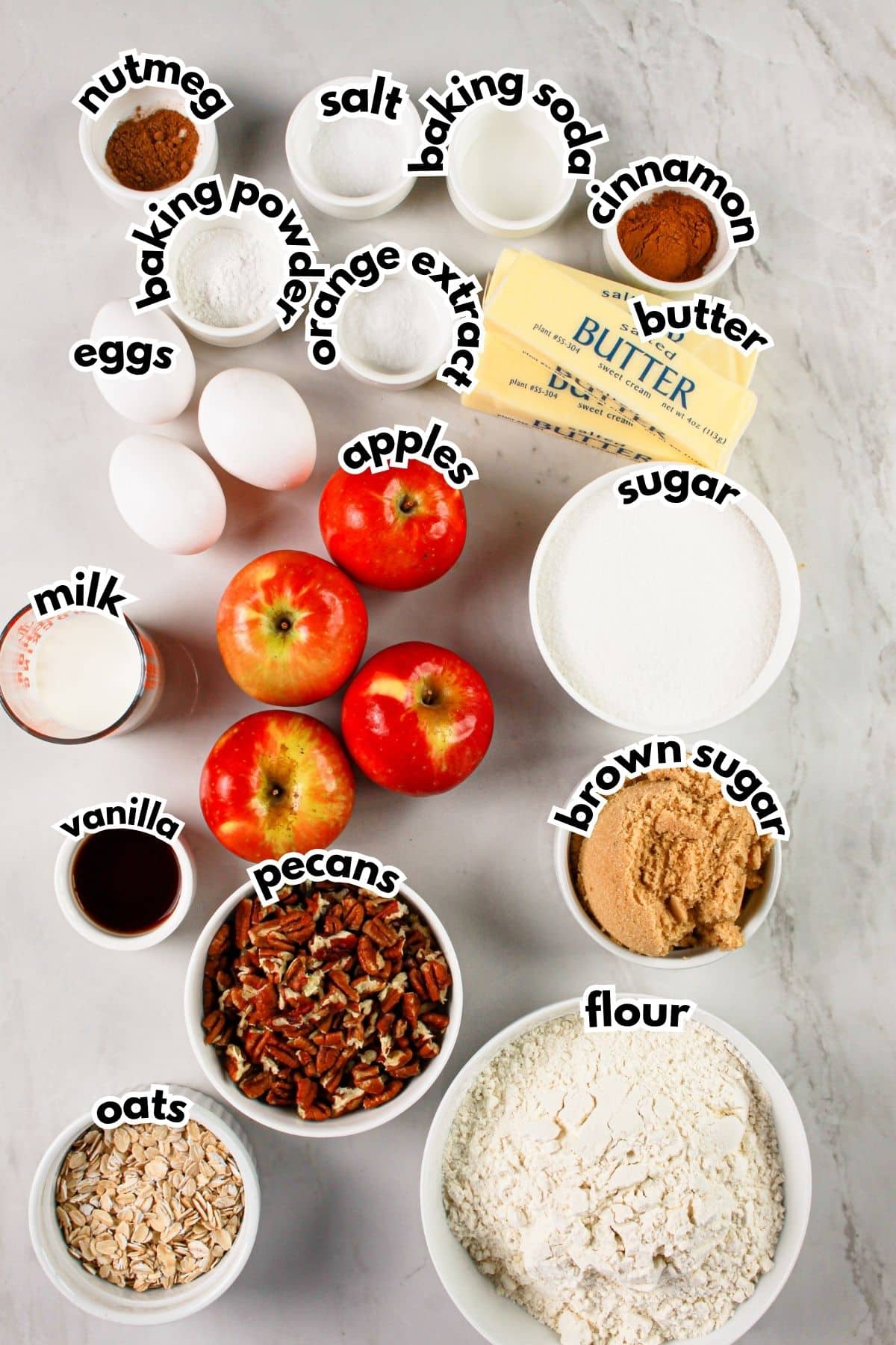Bowls of ingredients labelled with text on a counter.