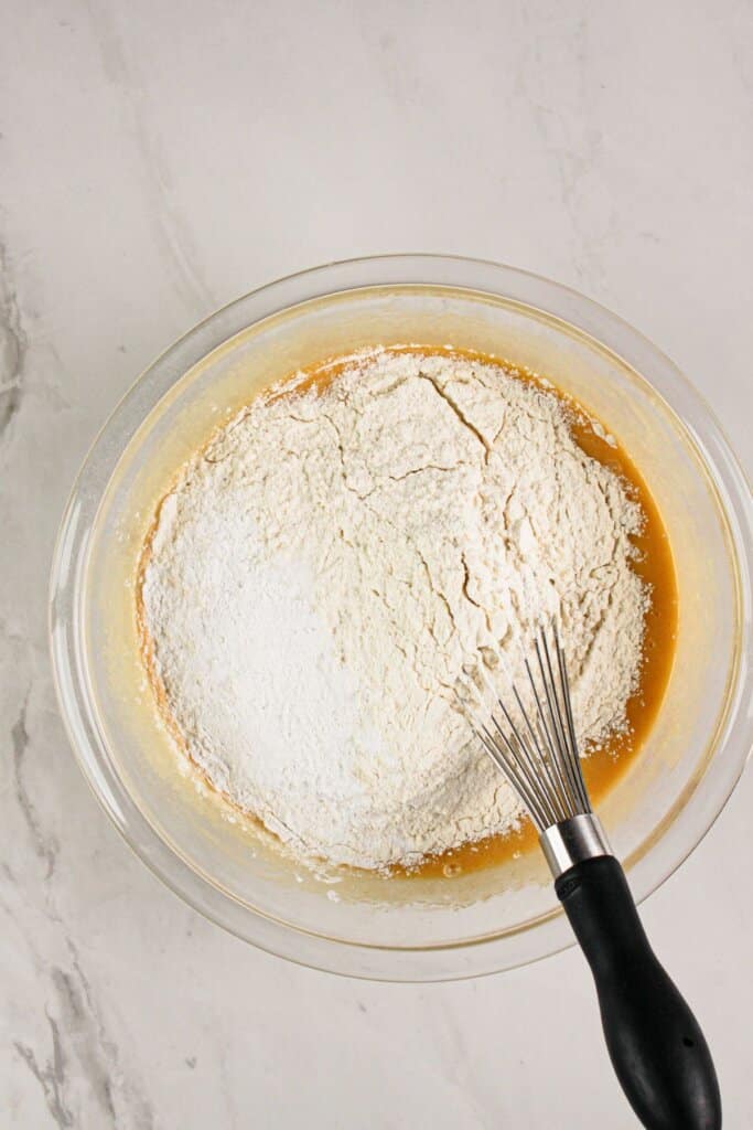 Dry ingredients being mixed into batter.