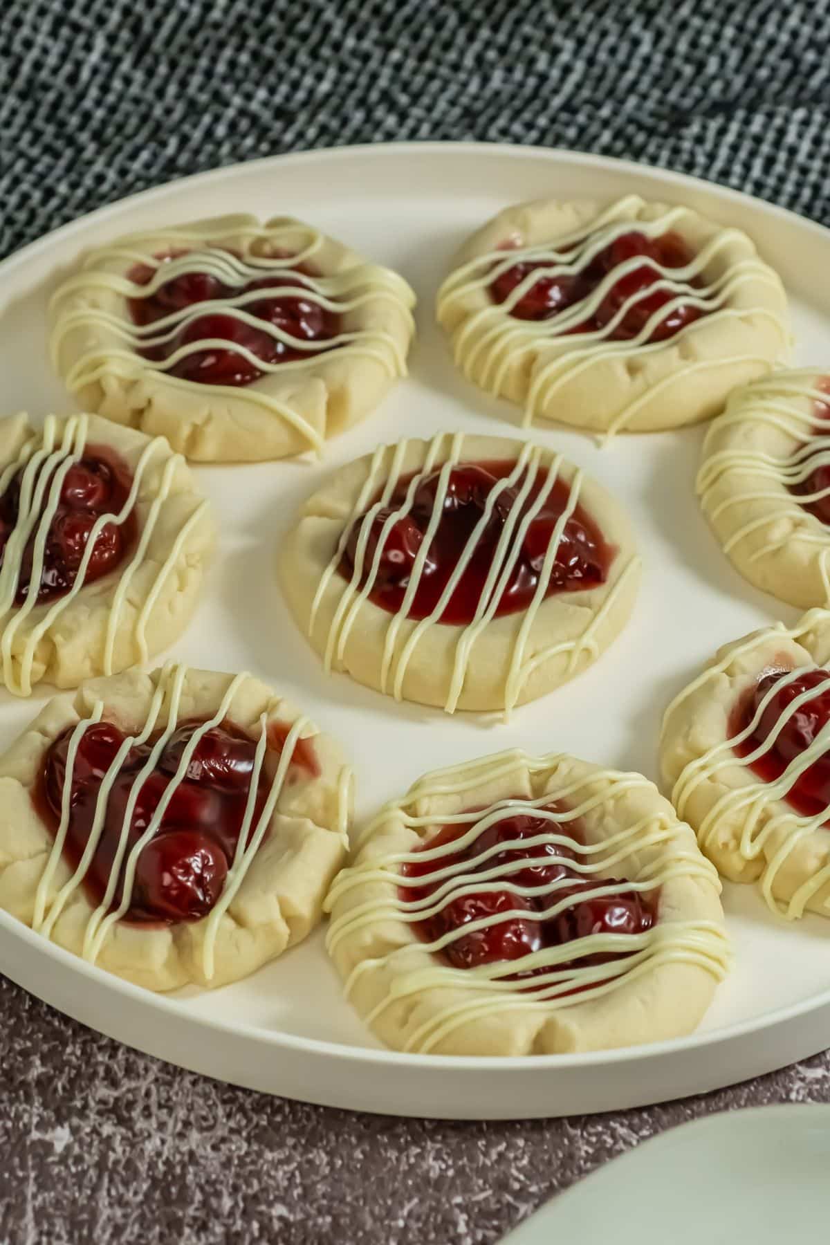 Cherry pie cookies on a plate.