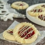 Two cherry pie cookies on a napkin.