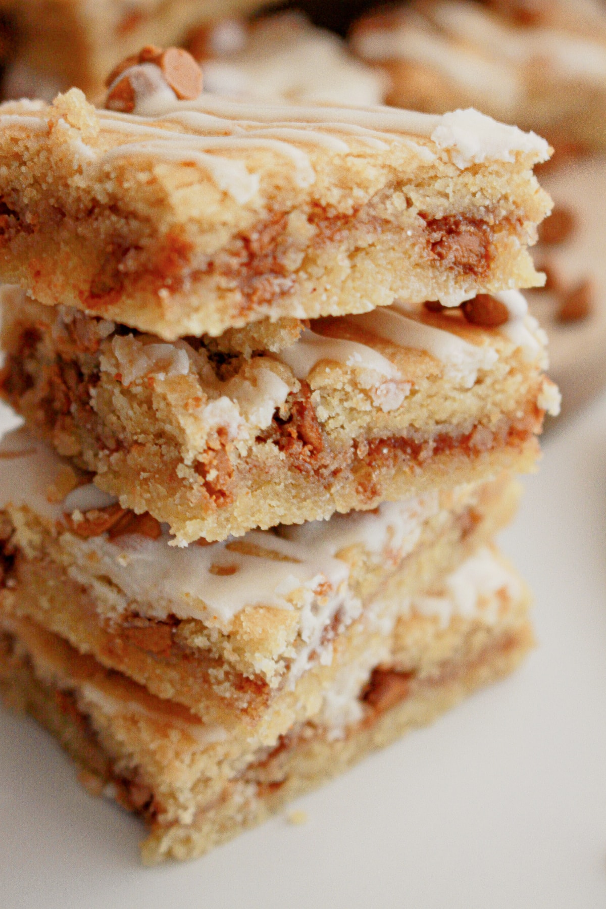 Four cinnamon chip cookie bars stacked on top of each other.