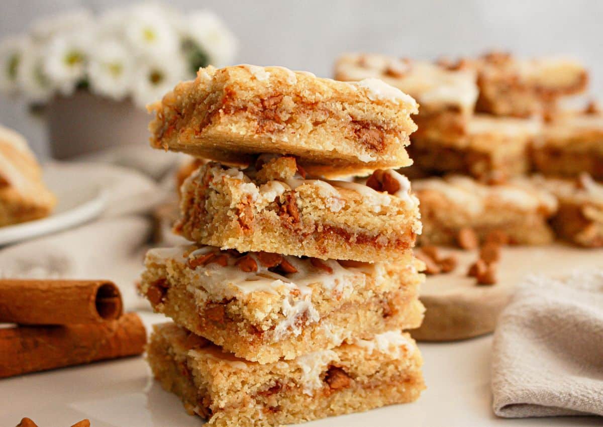 Four cinnamon chip cookie bars stacked on top of each other.