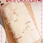 Cranberry white chocolate bread on a wooden cutting board.