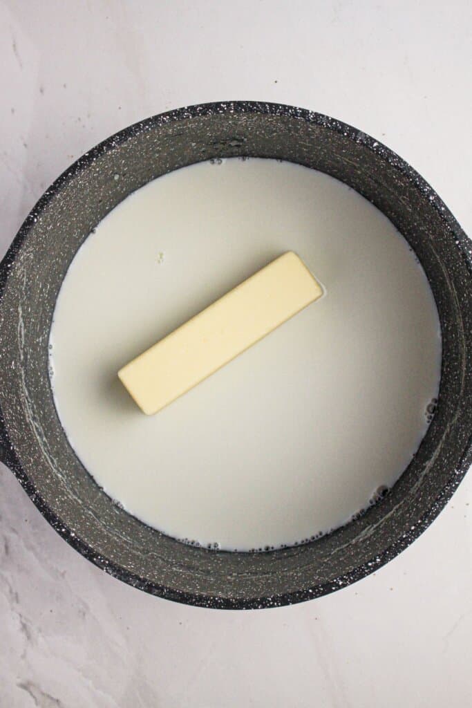 Butter and heavy cream in a pot.
