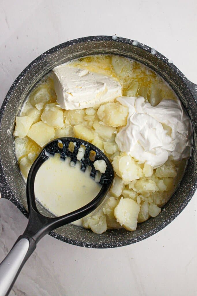 Sour cream being added to pot.