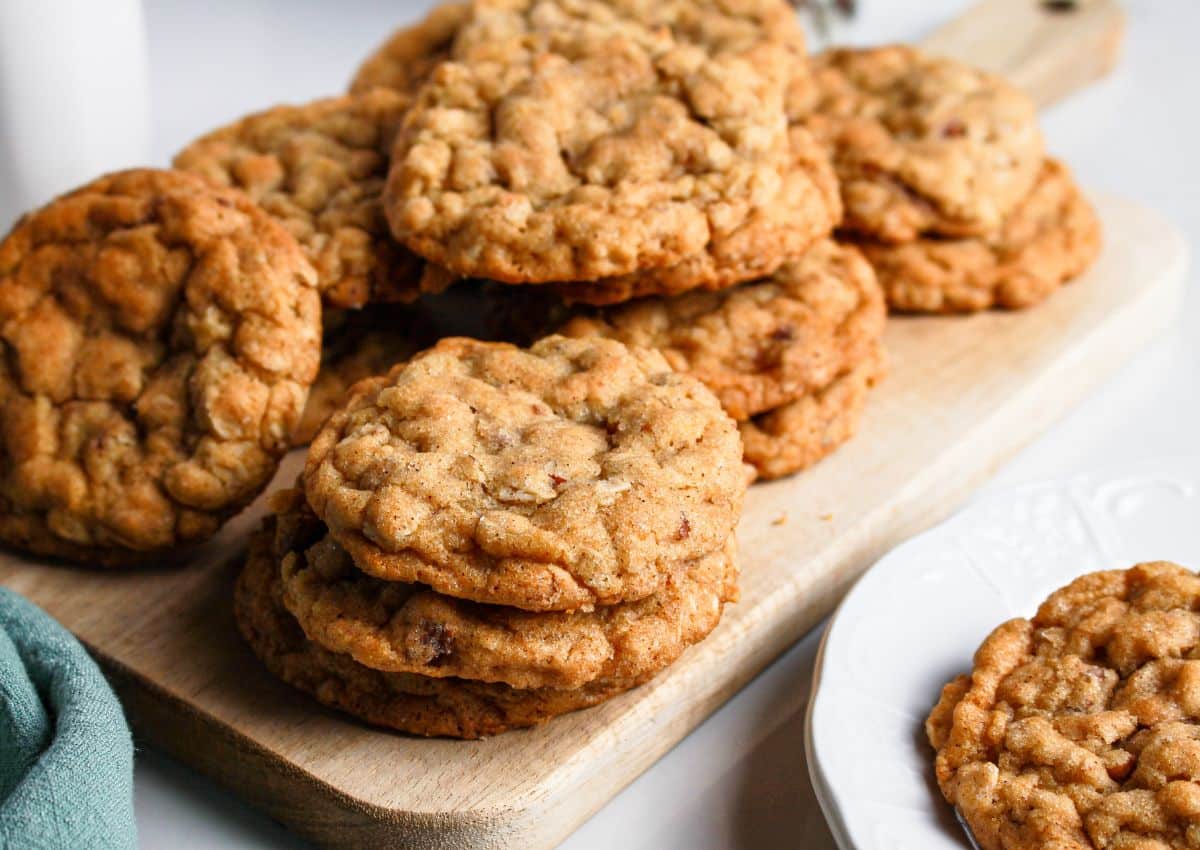 Maple oatmeal cookies on a wooden cutting board.