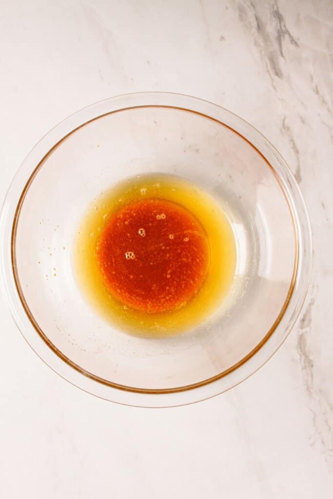 Browned butter in a glass bowl.
