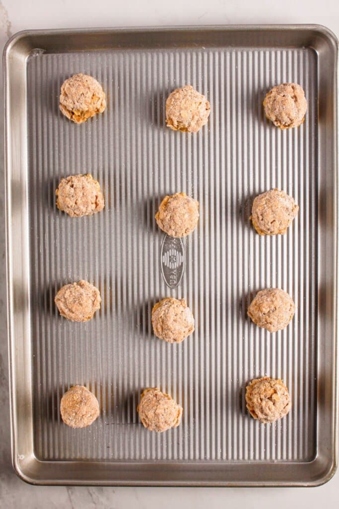 Dough balls on a baking dish.