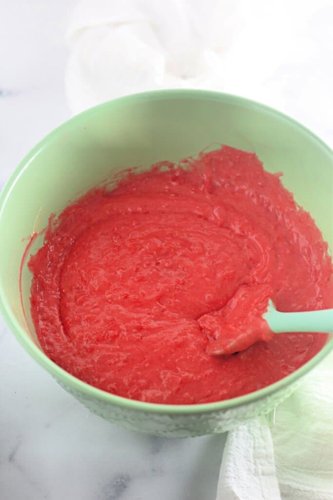 Batter being mixed in a large bowl.