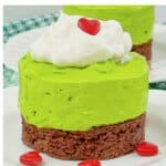 Mini grinch cheesecakes on a plate.