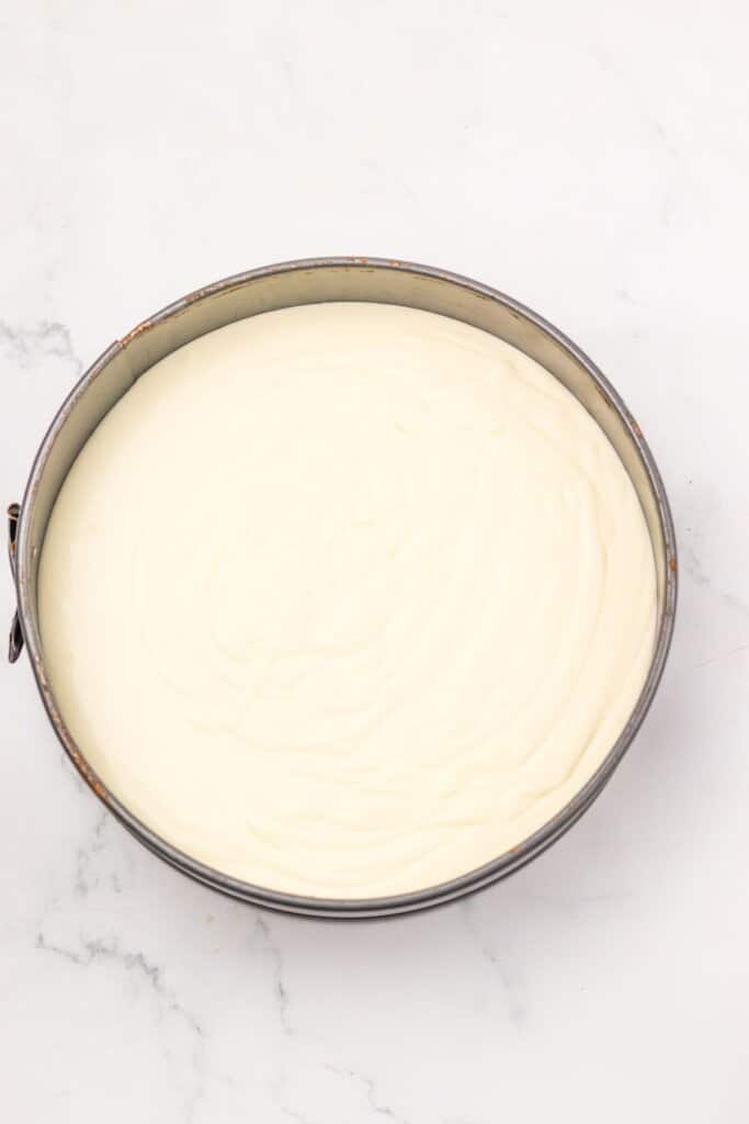 Cheesecake batter in a springform pan.