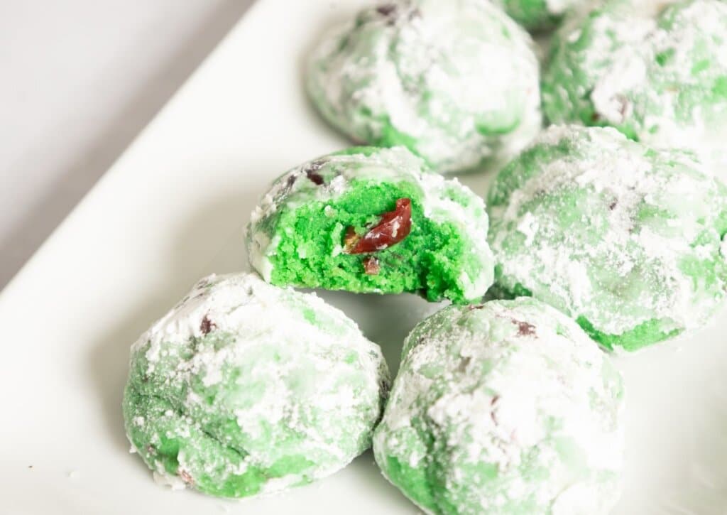 Pistachio cherry cookies on a platter.