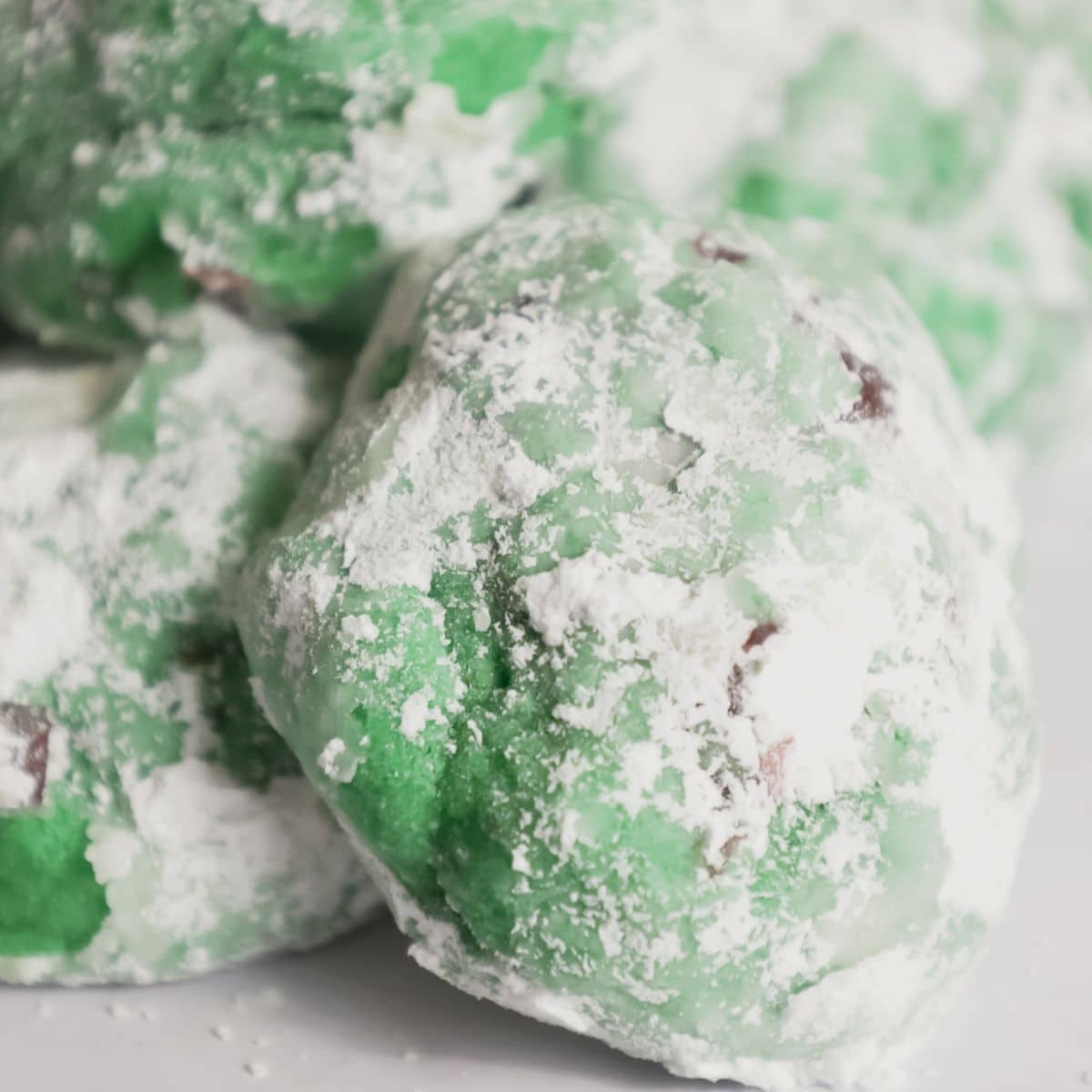 Pistachio cherry cookies on a platter.