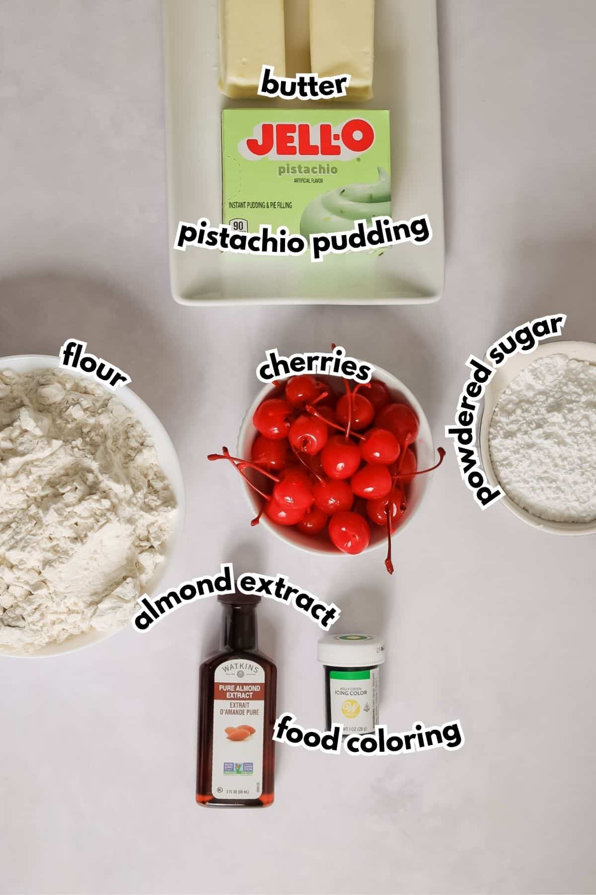 Bowls of ingredients labelled with text on a counter.