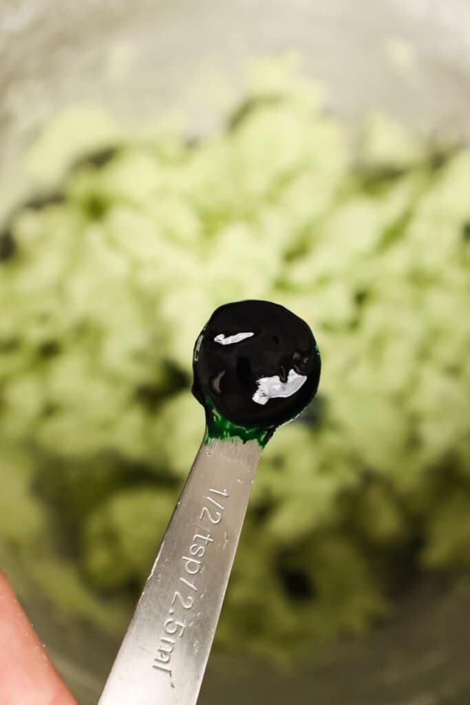 Food coloring being added to dough.