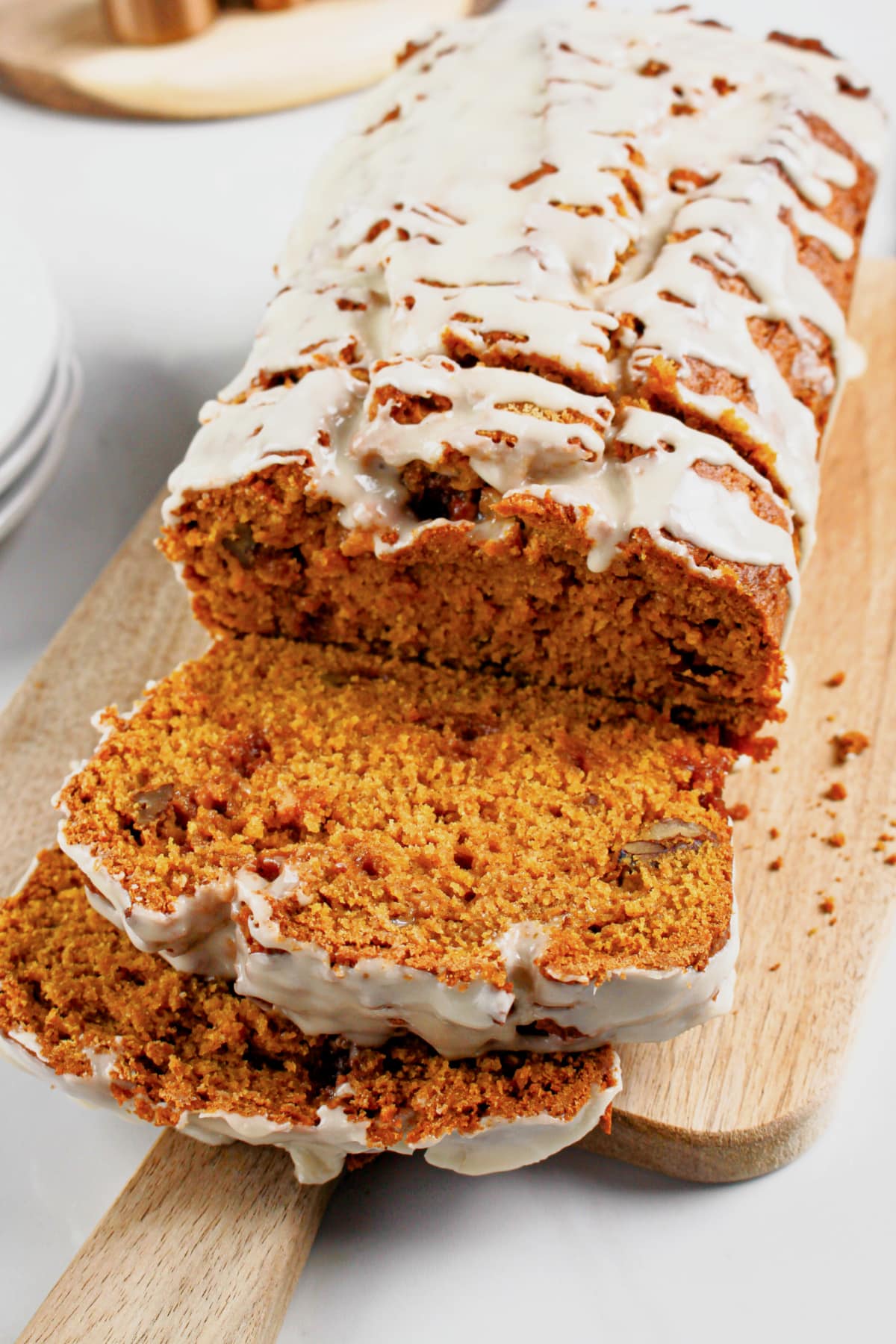 Slices of pumpkin butterscotch bread on a cutting board.