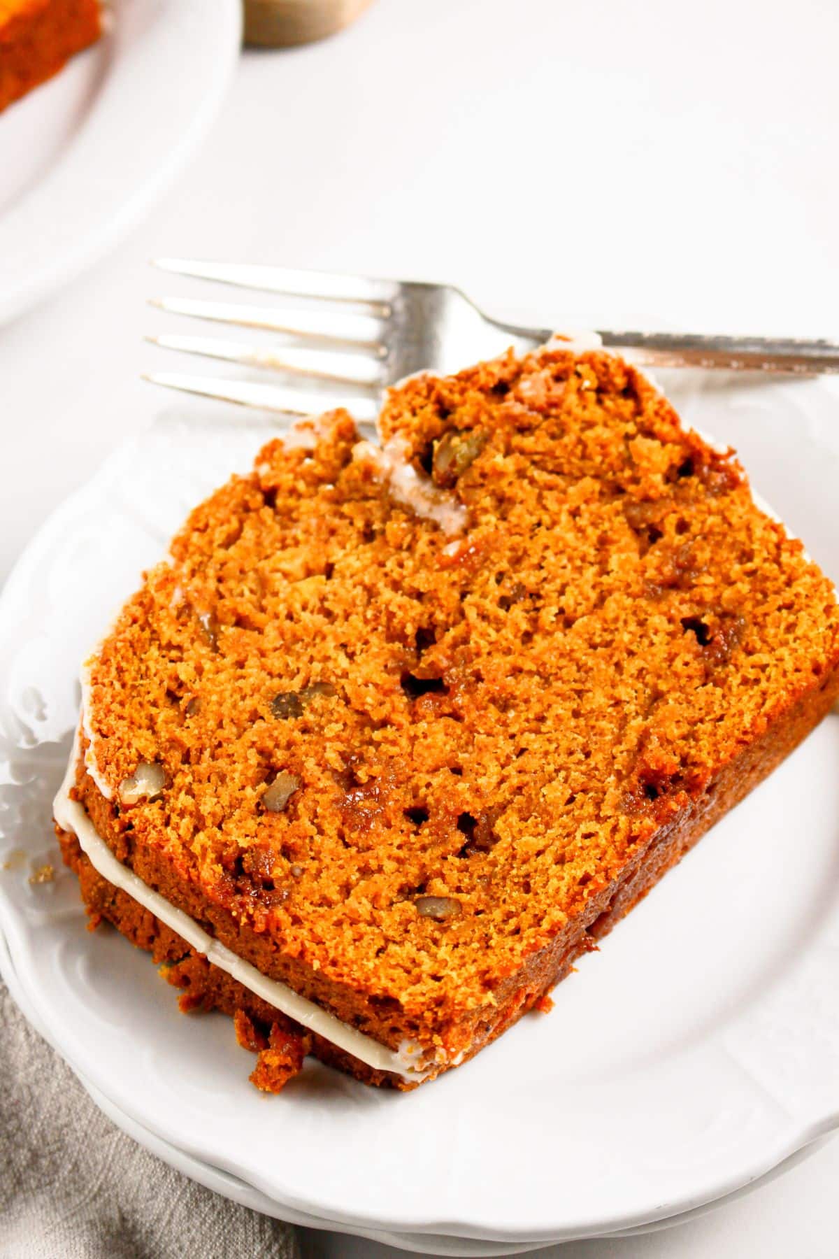Slice of pumpkin butterscotch bread on a plate.