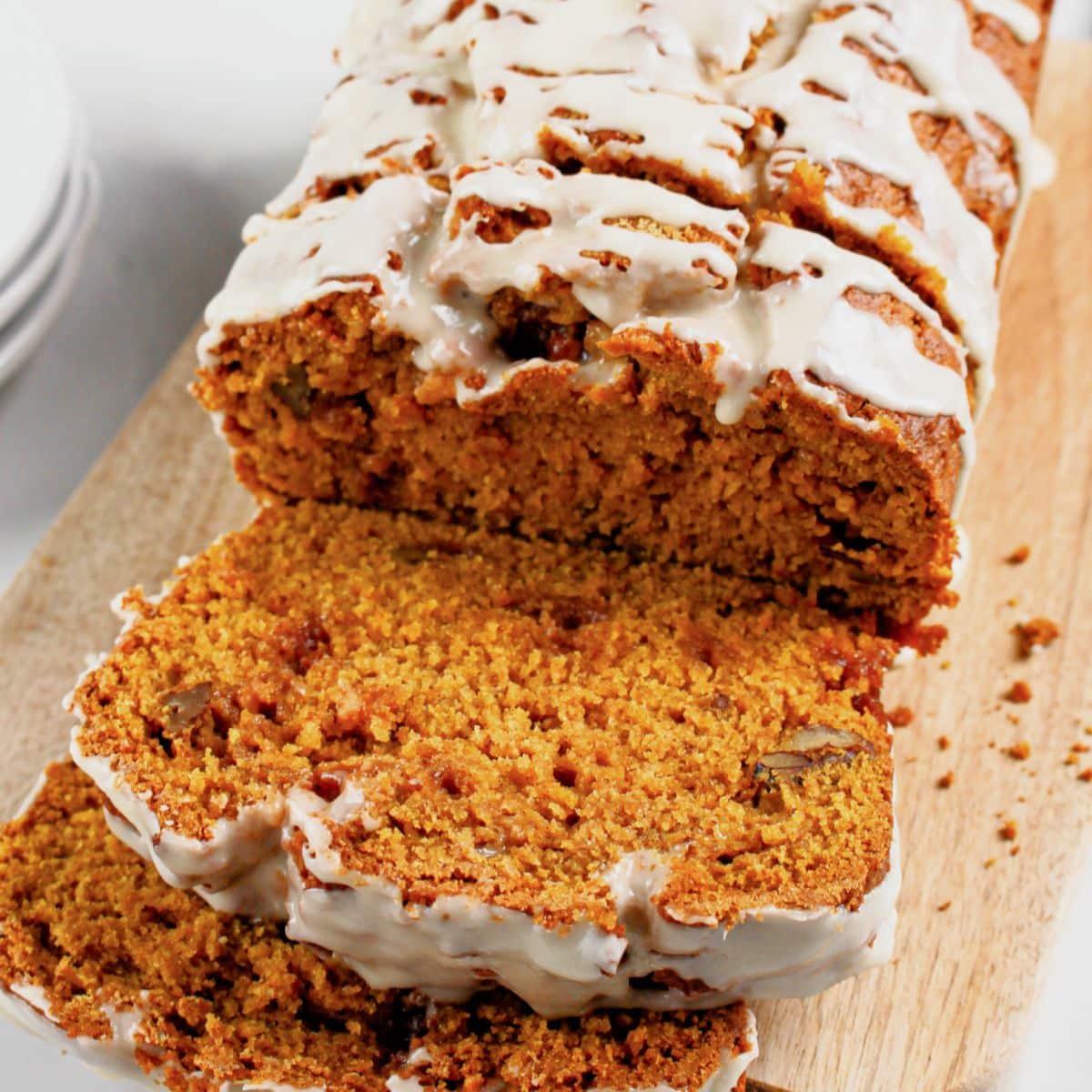 Slices of pumpkin butterscotch bread on a cutting board.