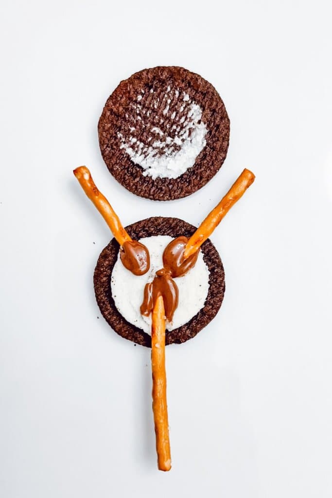 Pretzels being added to a cookie.