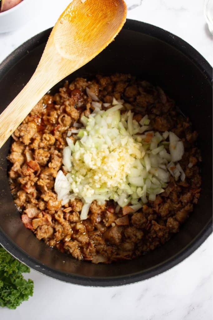 Onions and garlic in a pot.