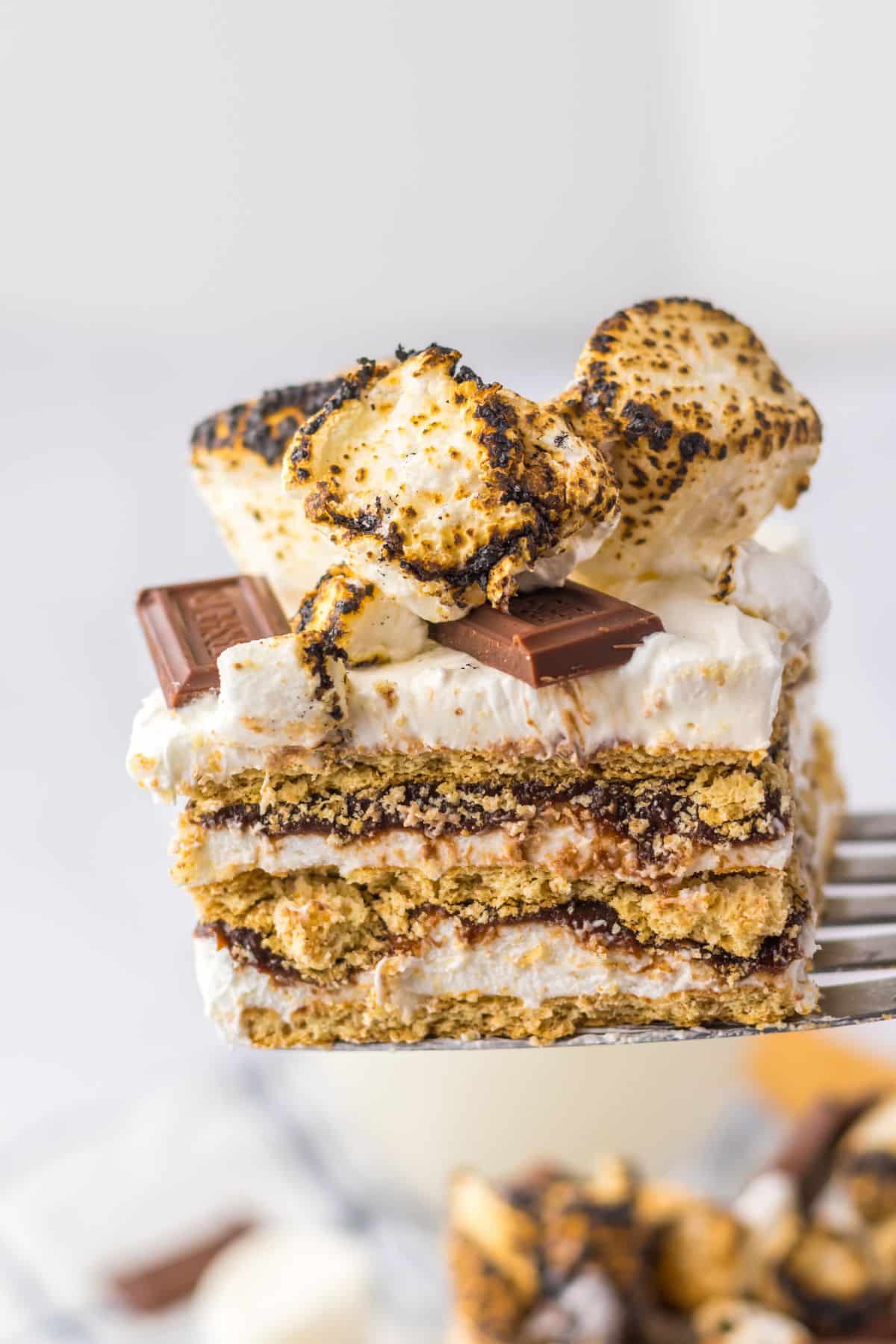 Slice of smores icebox cake on a spatula.