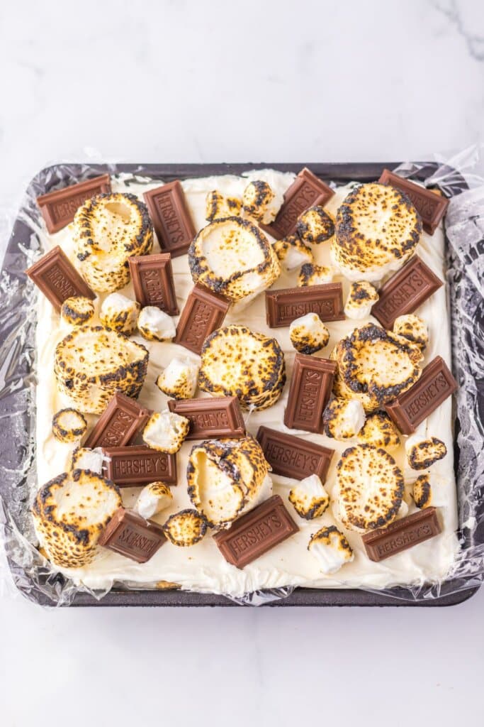 Icebox cake in a plastic wrap lined baking dish.