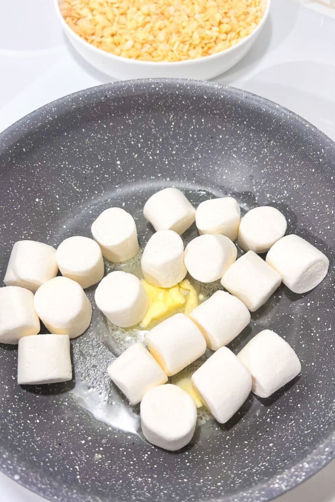 Marshmallows and butter melting in a skillet.