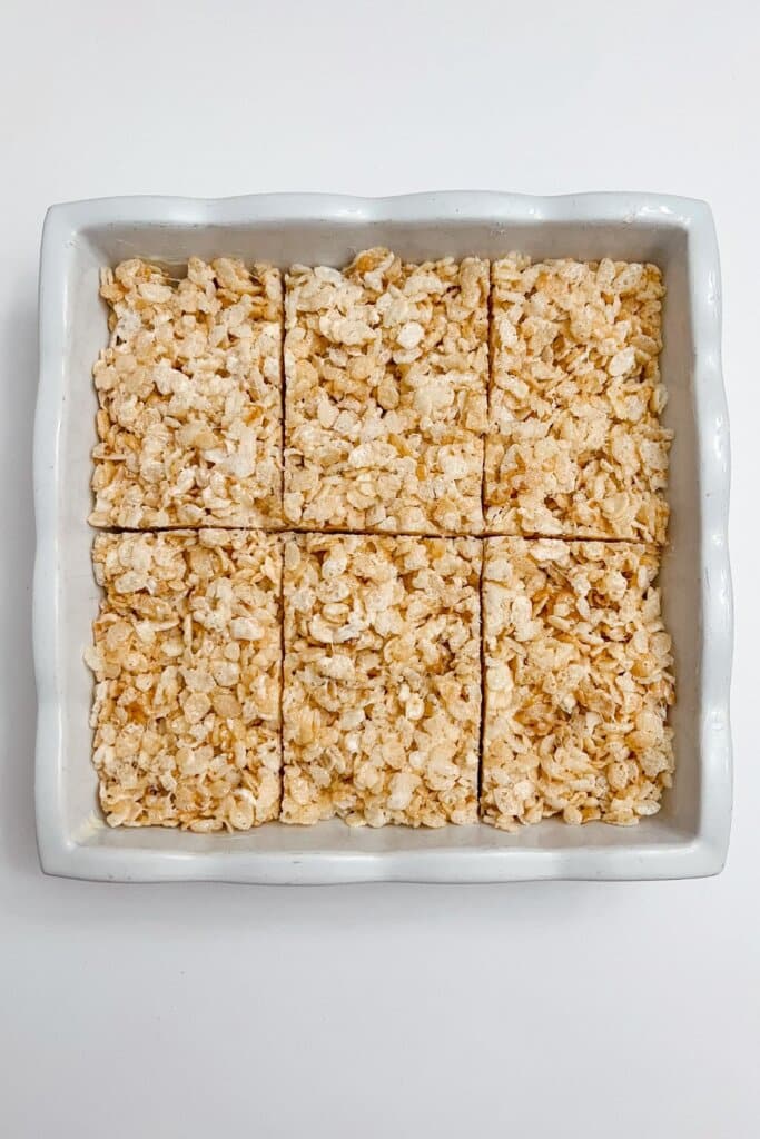 Dessert being cut into bars.