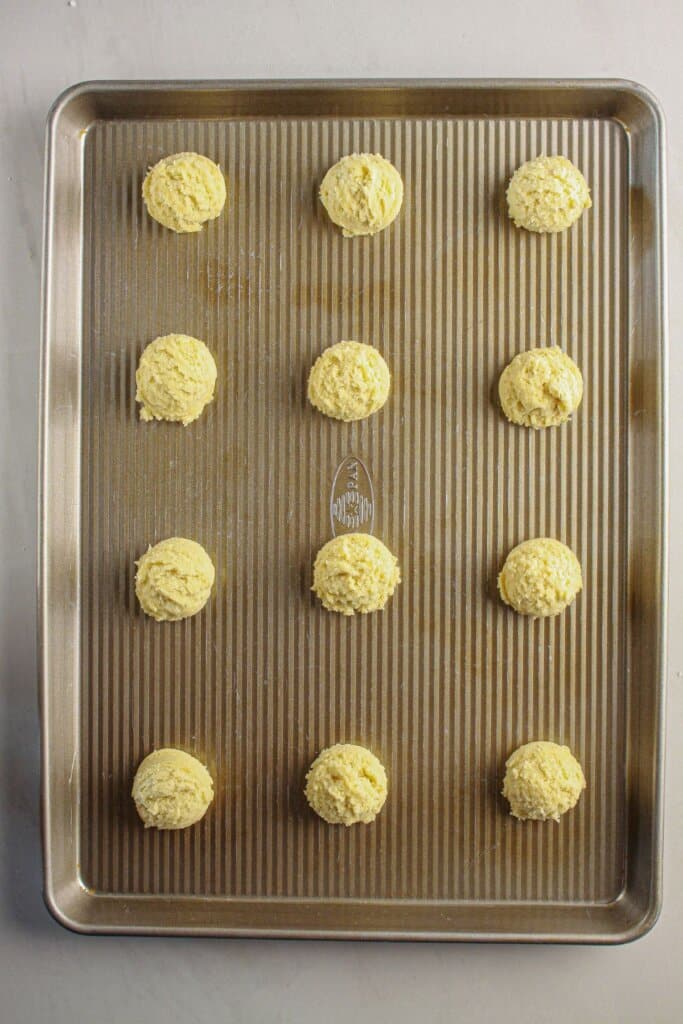 Dough balls on a baking sheet.