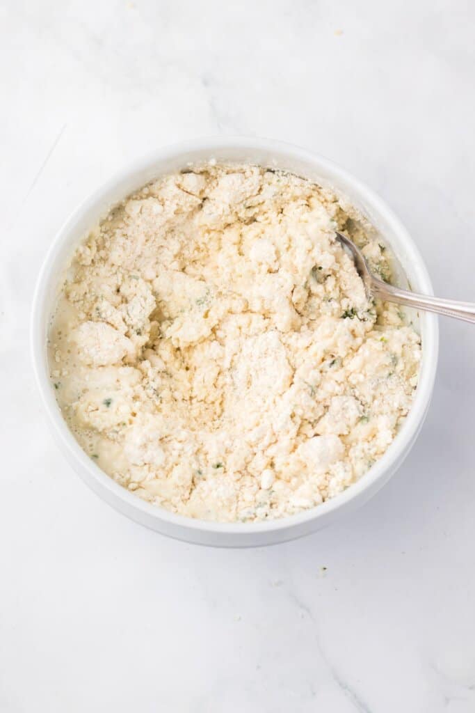 Baking mix being mixed in a bowl.