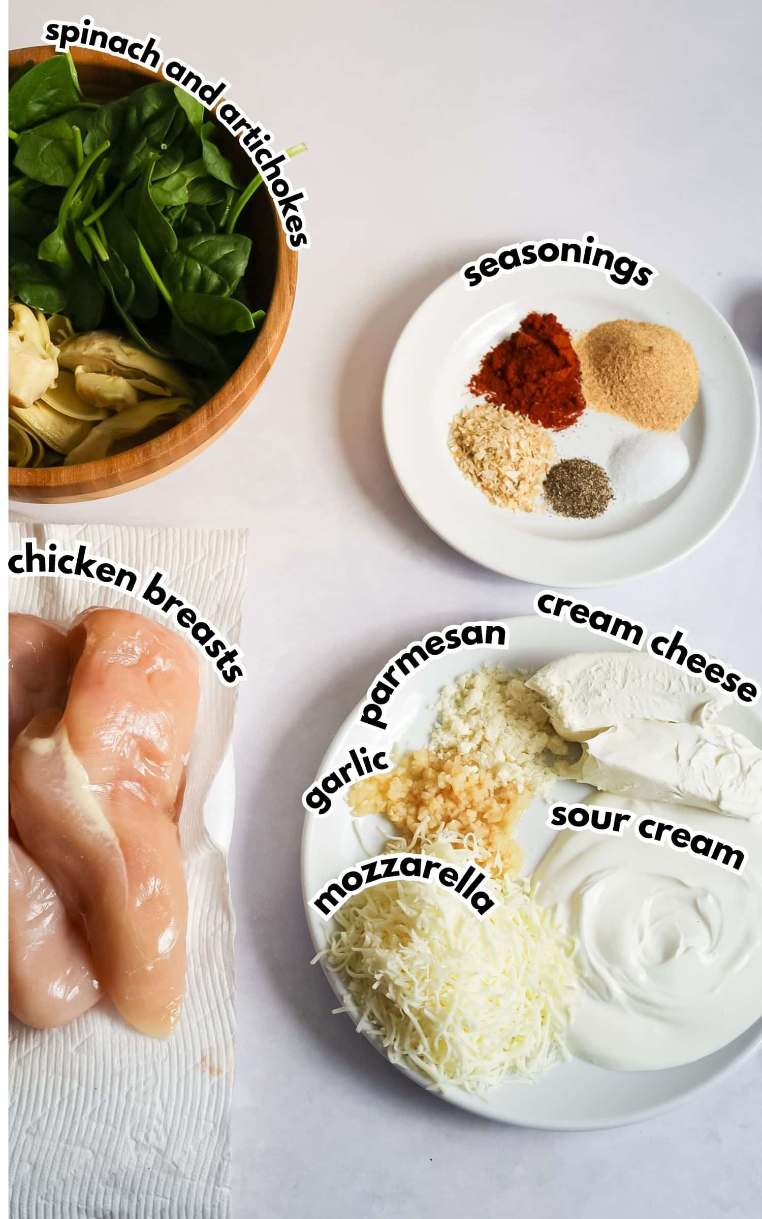 Bowls of ingredients labelled with text on a counter.